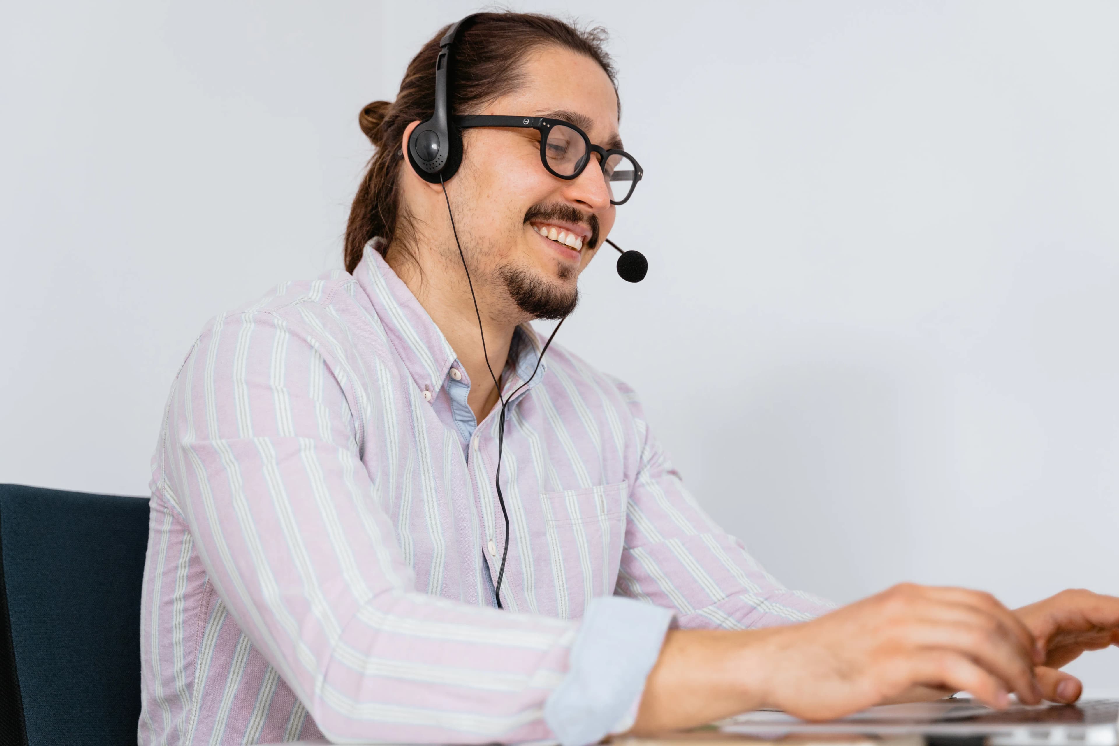 Office team member answering calls with a headset